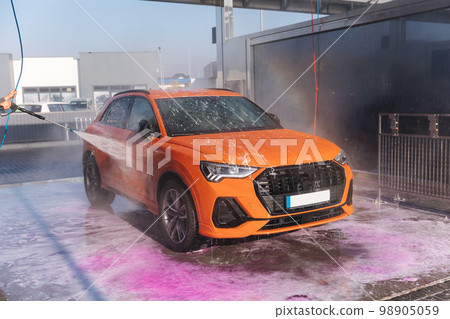 Process of cleaning car with a jet sprayer. Self service car washing 98905059