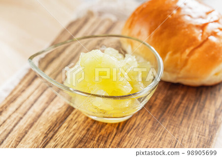 Homemade green apple jam and bread rolls Homemade green apple jam and bread rolls 98905699