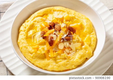 corn grits with butter, vegan cheese, and almonds corn grits with butter, vegan cheese, and almonds 98906190