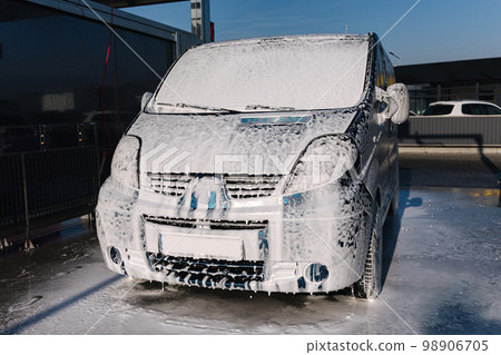 Mini bus on self servise car washing. Pink foam on auto 98906705