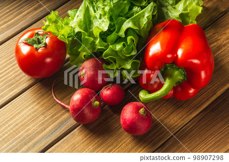 Set of vegetables for a salad diet. Cooking salad in the restaurant kitchen. Free advertising space Set of vegetables for a salad diet. Cooking salad in the restaurant kitchen. Free advertising space 98907298