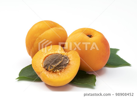Apricot sliced in a white background Apricot sliced in a white background 98908452