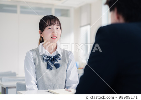 High school girl receiving career guidance at an interview High school girl receiving career guidance at an interview 98909171