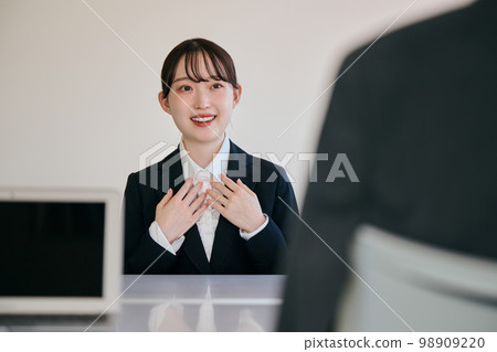 Young woman having a corporate interview Young woman having a corporate interview 98909220