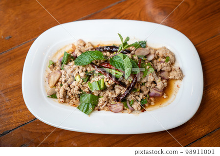 Larb moo is a type of pork salad. It is favorite of Isan people region of Thailand. famous Street food in Bangkok Thailand. Larb moo is a type of pork salad. It is favorite of Isan people region of Thailand. famous Street food in Bangkok Thailand. 98911001