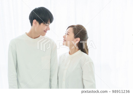 Young couple staring at each other Young couple staring at each other 98911236