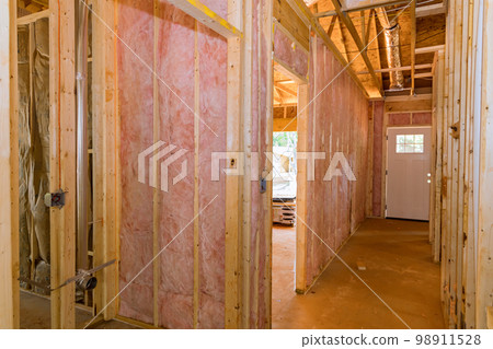 Communication lines and plumbing lines for newly constructed house are installed before plasterboard is applied 98911528