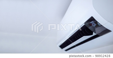 Air conditioner on white wall room interior background Air conditioner on white wall room interior background 98912428