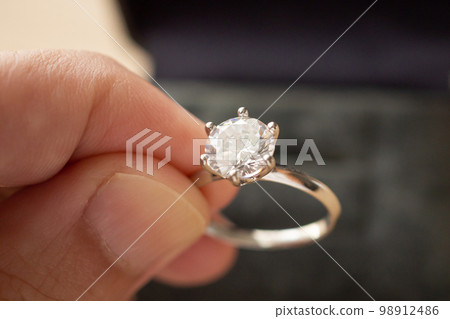 hand hold beautiful jewelry diamond ring hand hold beautiful jewelry diamond ring 98912486