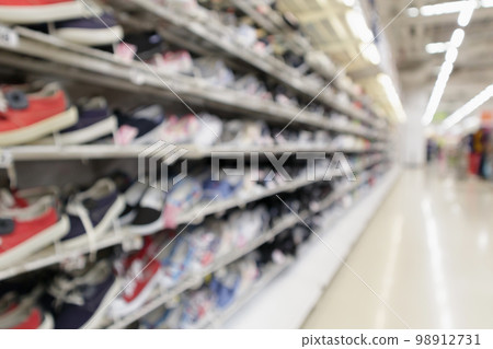 Abstract blur sport shoes on shelves in sneakers shop store background 98912731
