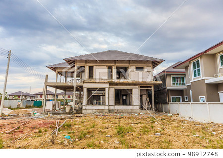 New house under construction at building site 98912748