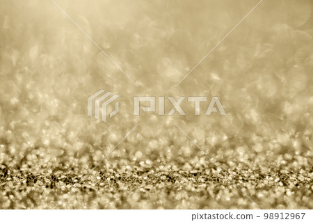 Abstract gold glitter sparkle blurred with bokeh background Abstract gold glitter sparkle blurred with bokeh background 98912967