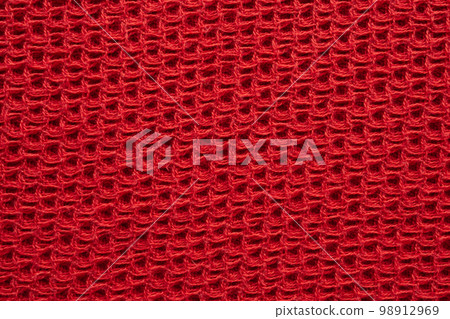 Red knitted cloth wool texture surface background Red knitted cloth wool texture surface background 98912969