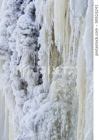 Frozen small mountain waterfall close up. Frozen Jagala Falls, Estonia 98918241