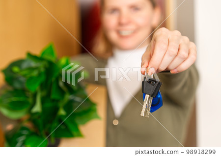 Starting new life. Overjoyed woman hold keys from new apartment or home. new life starts now Starting new life. Overjoyed woman hold keys from new apartment or home. new life starts now 98918299