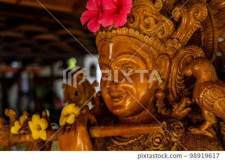 Wood carving sculpture of Lord Krishna close up. Selective focus Wood carving sculpture of Lord Krishna close up. Selective focus 98919617