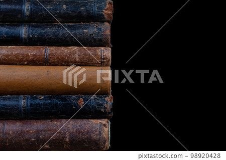 Old vintage books on black background 98920428