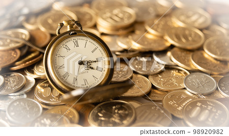 Pocket watch and coins Time is money 98920982