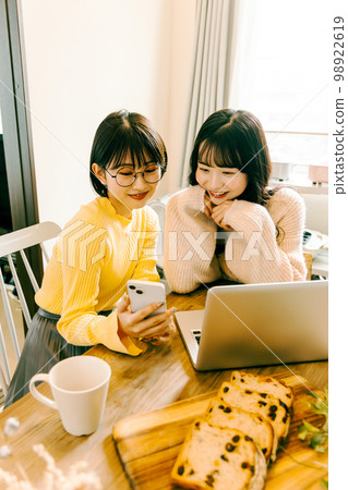 Woman thinking about travel plans 98922619