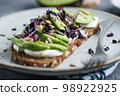Toast with avocado on plate 98922925