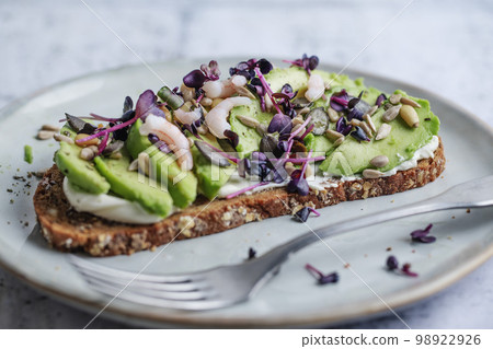 Toast with avocado on plate 98922926