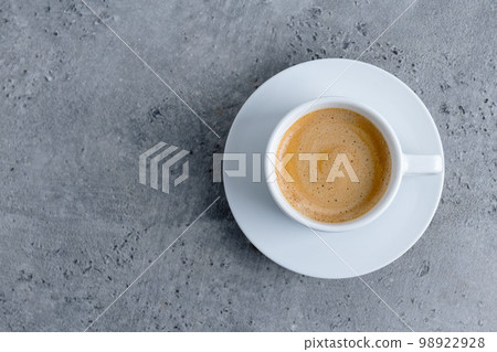 Espresso cup on grey background Espresso cup on grey background 98922928