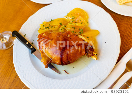 Popular dish of Spanish cuisine is Toston asado Popular dish of Spanish cuisine is Toston asado 98925101