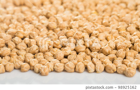 Chickpeas on white surface Chickpeas on white surface 98925162