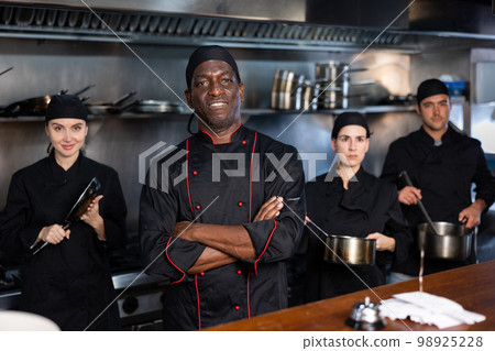 Team of chefs with man head chef 98925228