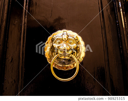 Traditional old antient Maltese door knob in Mdina city on Malta Traditional old antient Maltese door knob in Mdina city on Malta 98925315