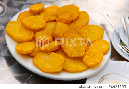 Dish of Spanish cuisine Patatas Bravas 98925565