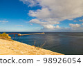 Valetta, Malta - 12 16 22: sea view to Pont Sant Elmo bridge and lighthouse in sunny weather with dramatic sky 98926054
