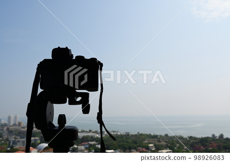 black digital camera shooting city landscape 98926083