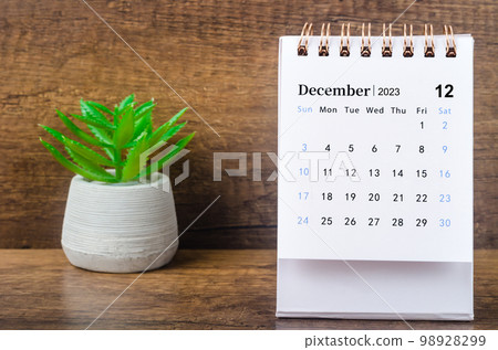 The December 2023 Monthly desk calendar for 2023 year with plant pot. 98928299