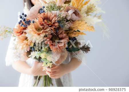 A girl with a bouquet 98928375