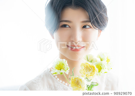 A woman with flowers A woman with flowers 98929070