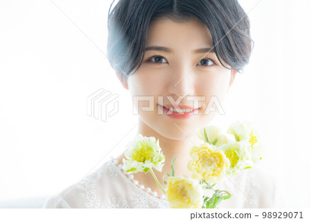 A woman with flowers 98929071