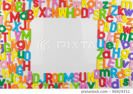 Colorful alphabet magnets on whiteboard framing copy space Colorful alphabet magnets on whiteboard framing copy space 98929352