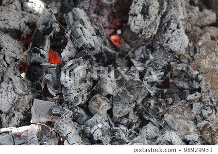 Ash embers close-up black and white grey with red weekend barbecue holiday background Ash embers close-up black and white grey with red weekend barbecue holiday background 98929931