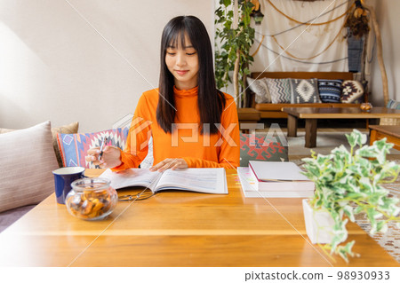 Young woman studying for qualification Young woman studying for qualification 98930933