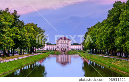 Schloss Nymphenburg, a Baroque palace in Munich, Bavaria at sunset - Germany 98931221