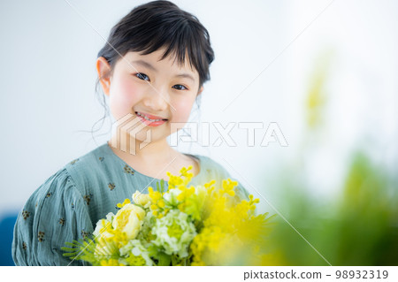 girl with a bouquet of mimosas girl with a bouquet of mimosas 98932319