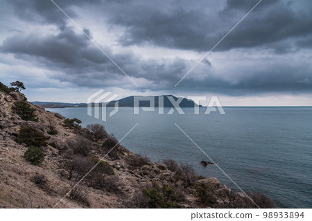 View on Meganom Cape from Cape Alchak in cloudy weather. Crimea View on Meganom Cape from Cape Alchak in cloudy weather. Crimea 98933894