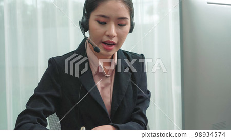 Enthusiastic female operator provide helpful customer service to customer. 98934574