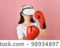 Asian woman using vr glasses, Working out with boxing video games application from virtual reality 98934897