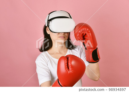 Asian woman using vr glasses, Working out with boxing video games application from virtual reality 98934897