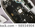 Separated parts of broken mouse, Disassembled computer mouse for repair and fixing. 98934904
