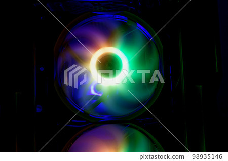 Computer cooler with RGB LED light. Computer circuit board and CPU cooling fans illuminated Computer cooler with RGB LED light. Computer circuit board and CPU cooling fans illuminated 98935146