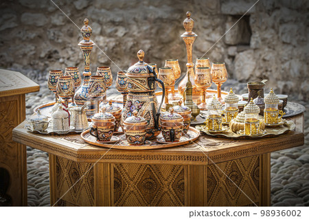 metal utensils made up of copper and brass. Teapots, cups, lamps, jugs, made of gold, brass, handmade silver metal utensils made up of copper and brass. Teapots, cups, lamps, jugs, made of gold, brass, handmade silver 98936002