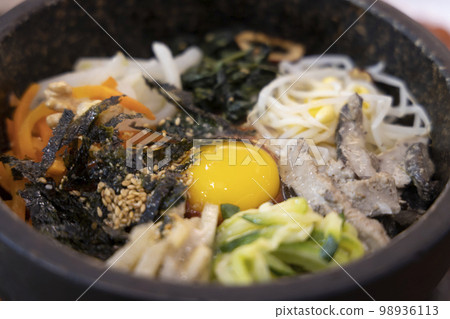 Bibimbap in a bowl 98936113